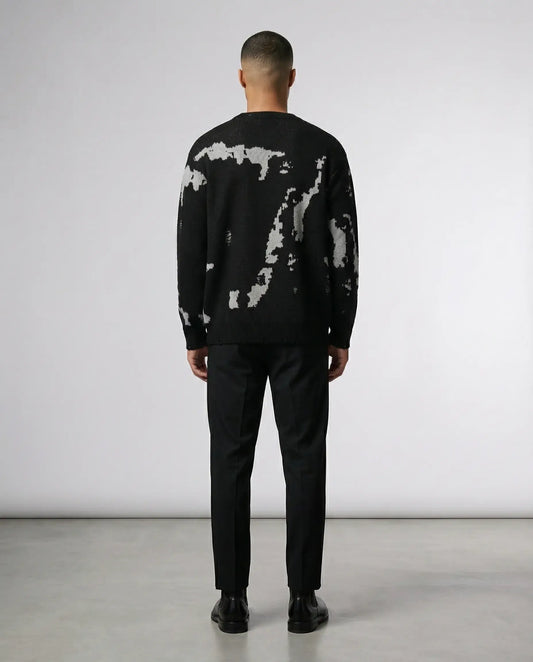 Black abstract knit sweater by Ilynora, back view highlighting artistic pattern and clean silhouette