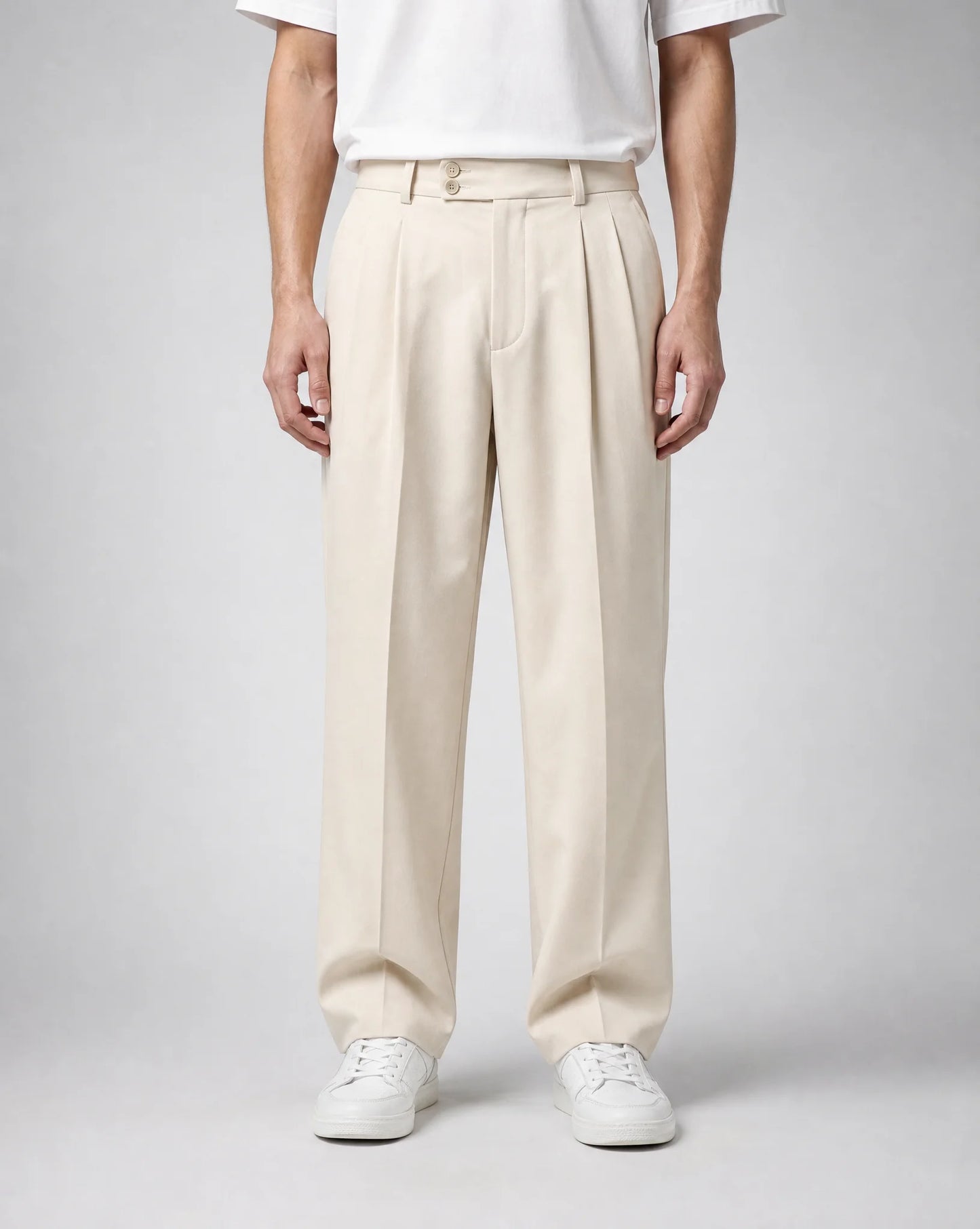 Men's beige wide leg pleated tailored trousers with double front pleats, relaxed fit and elegant contemporary tailoring by ILYNORA