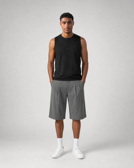 Full outfit featuring men's grey baggy bermuda shorts with front pleats, oversized fit and tailored summer styling by ILYNORA