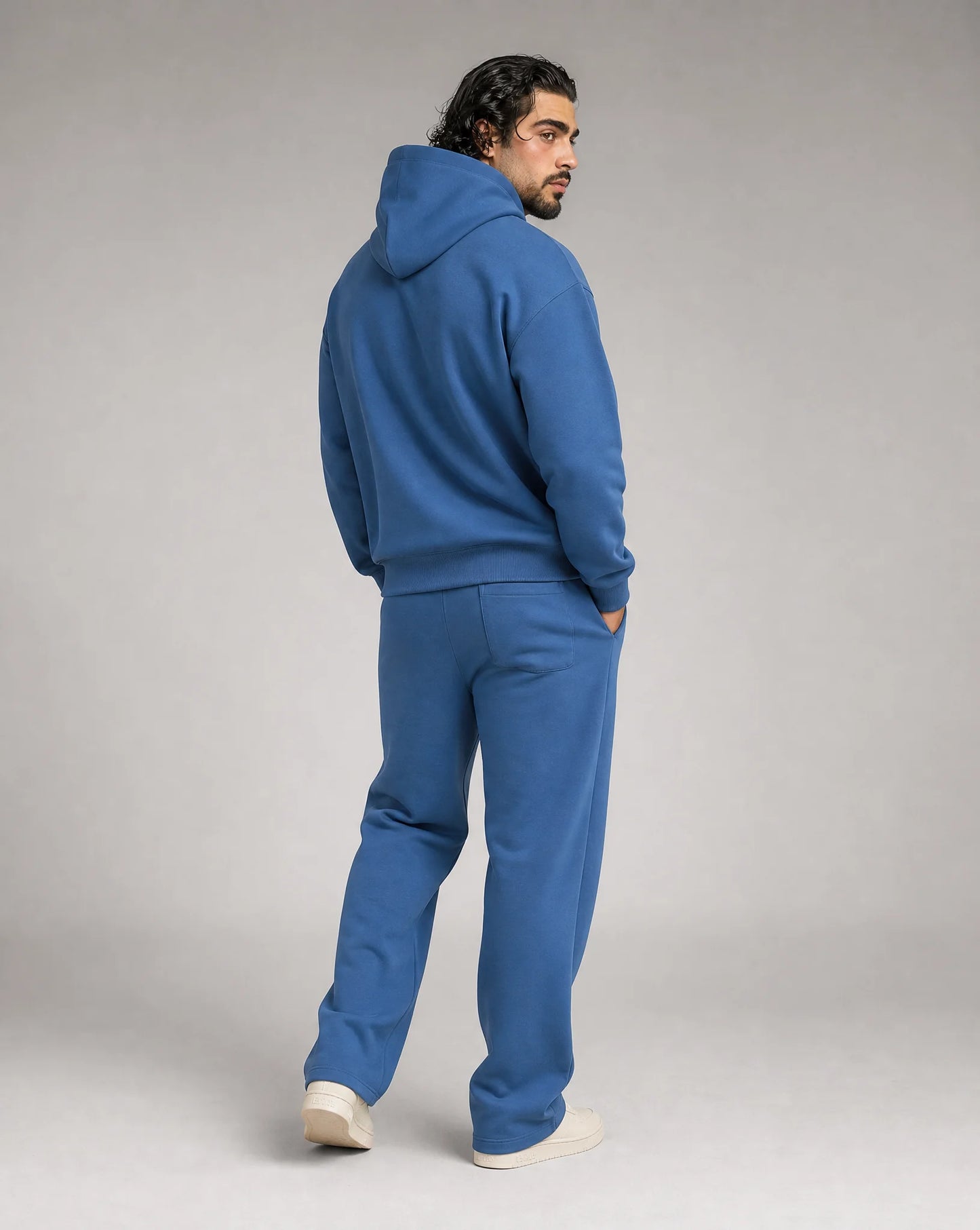 Blue oversized hoodie and jogger set for men by Ilynora, back view with comfortable oversized fit