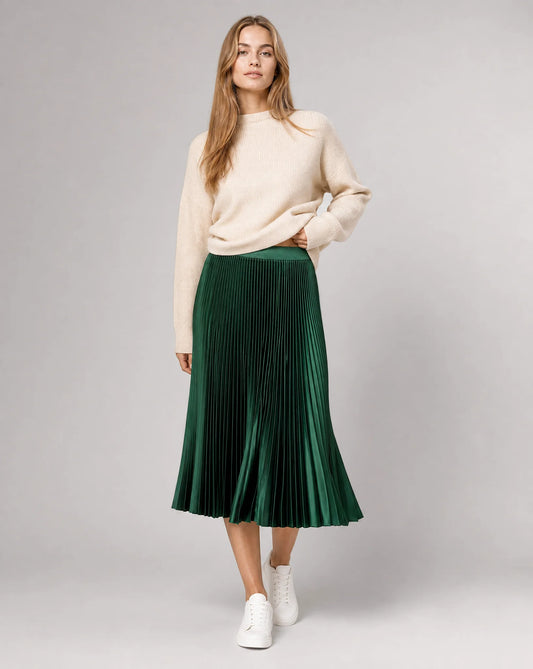 Green pleated midi skirt for women by Ilynora, full length view showcasing graceful movement and elegant drape