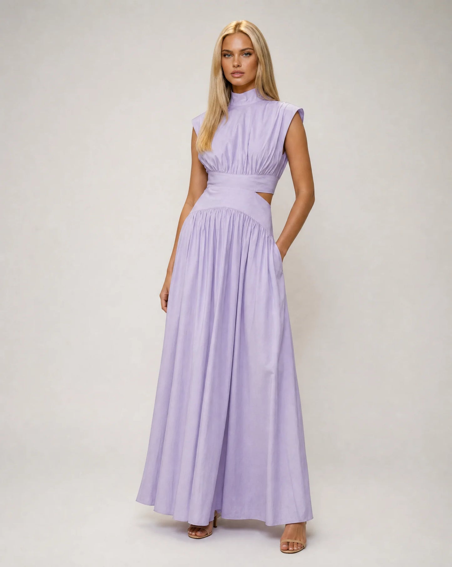 Purple sleeveless cut out maxi dress for women by Ilynora, front view with graceful movement and elegant design