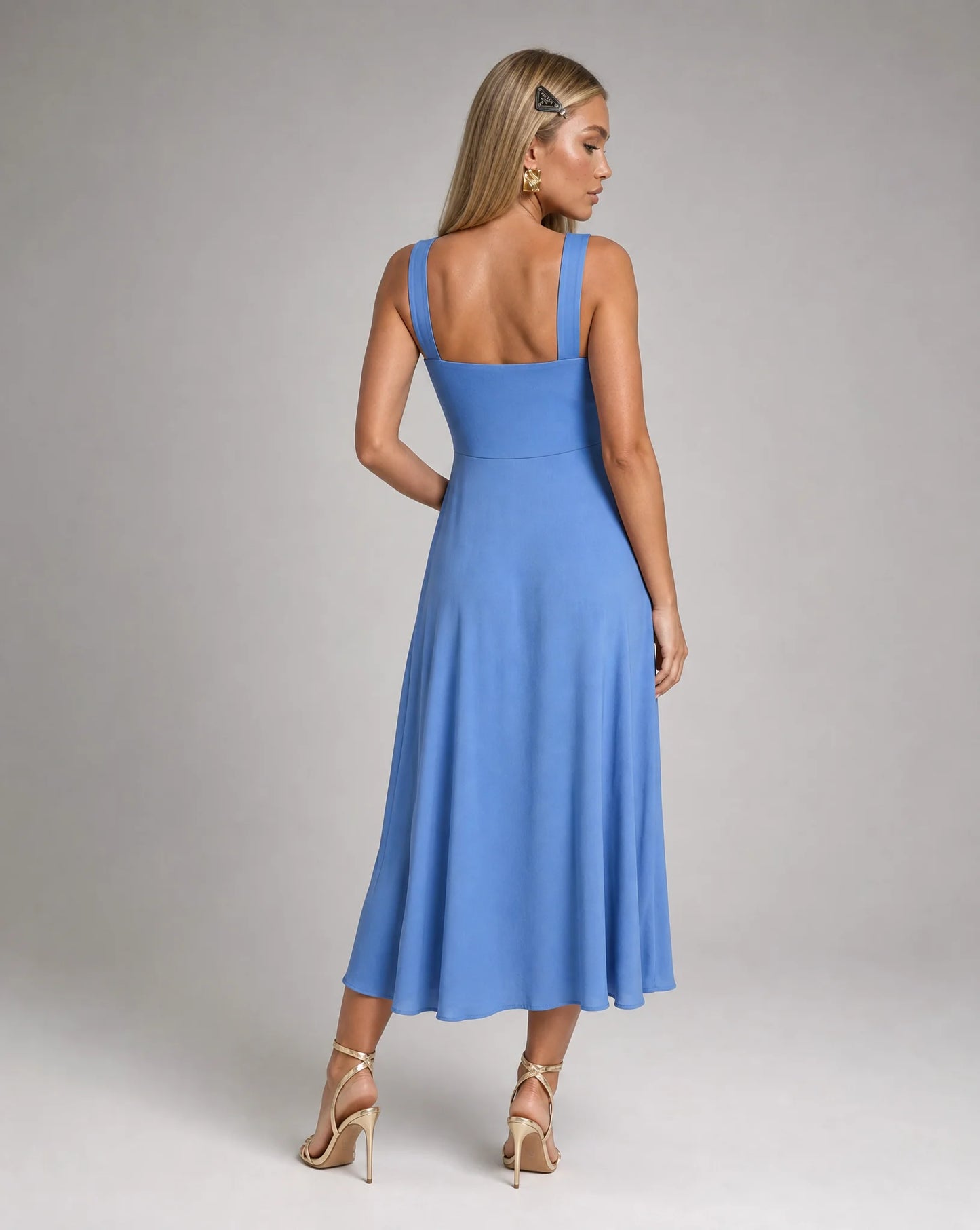 Blue square neck midi dress for women by Ilynora, angled view highlighting the elegant neckline and flowing fit