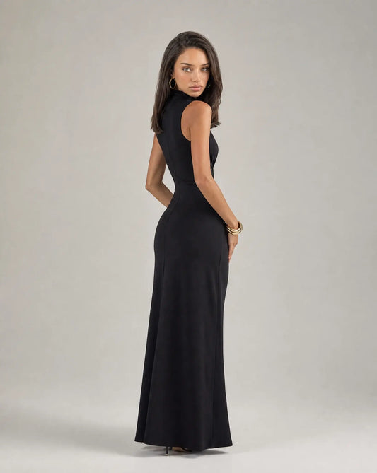 Black high neck ruched maxi dress for women by Ilynora, side view highlighting the fitted silhouette and waist detail