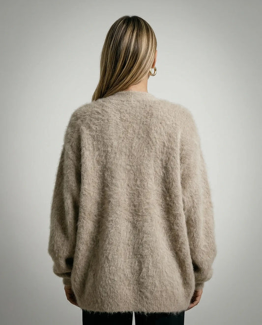 Beige wool blend cardigan by Ilynora, back view highlighting slightly oversized silhouette and brushed finish