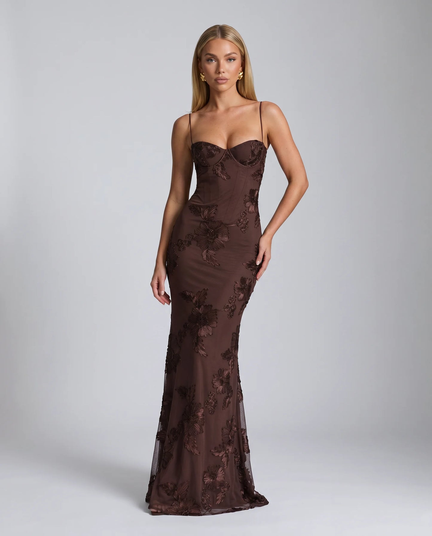 Brown floral lace up back maxi dress with fitted bodice and sophisticated evening styling by ILYNORA