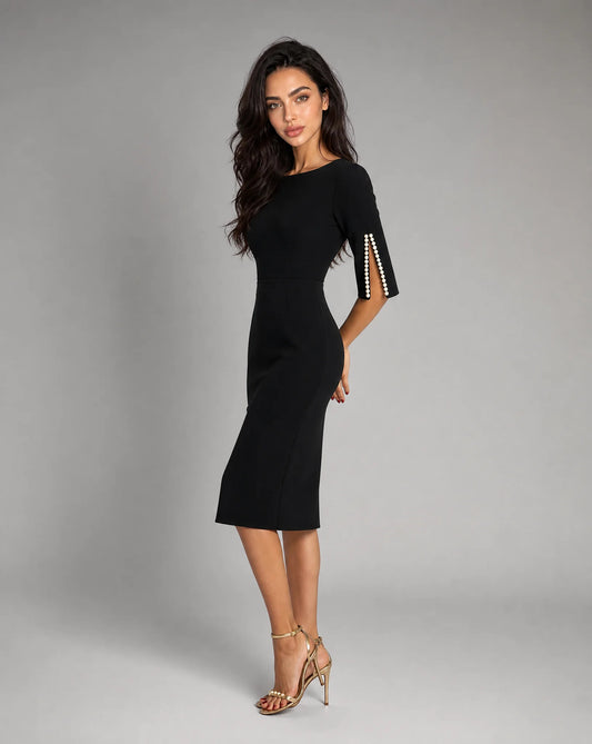 Women's black midi dress with pearl embellished sleeves and timeless evening style by ILYNORA