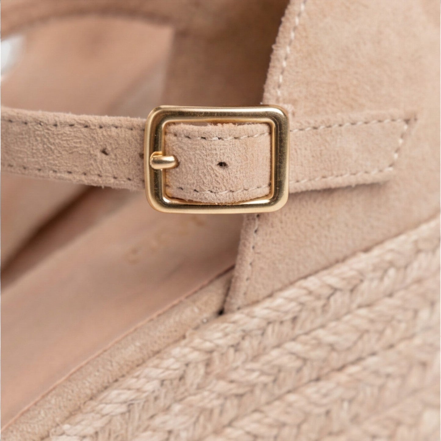 Close-up of women's beige closed toe espadrille wedges with gold buckle, soft suede upper and braided jute sole by ILYNORA