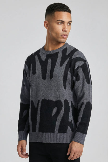 Grey abstract jacquard knit crew neck jumper for men by Ilynora London, side view with modern relaxed fit