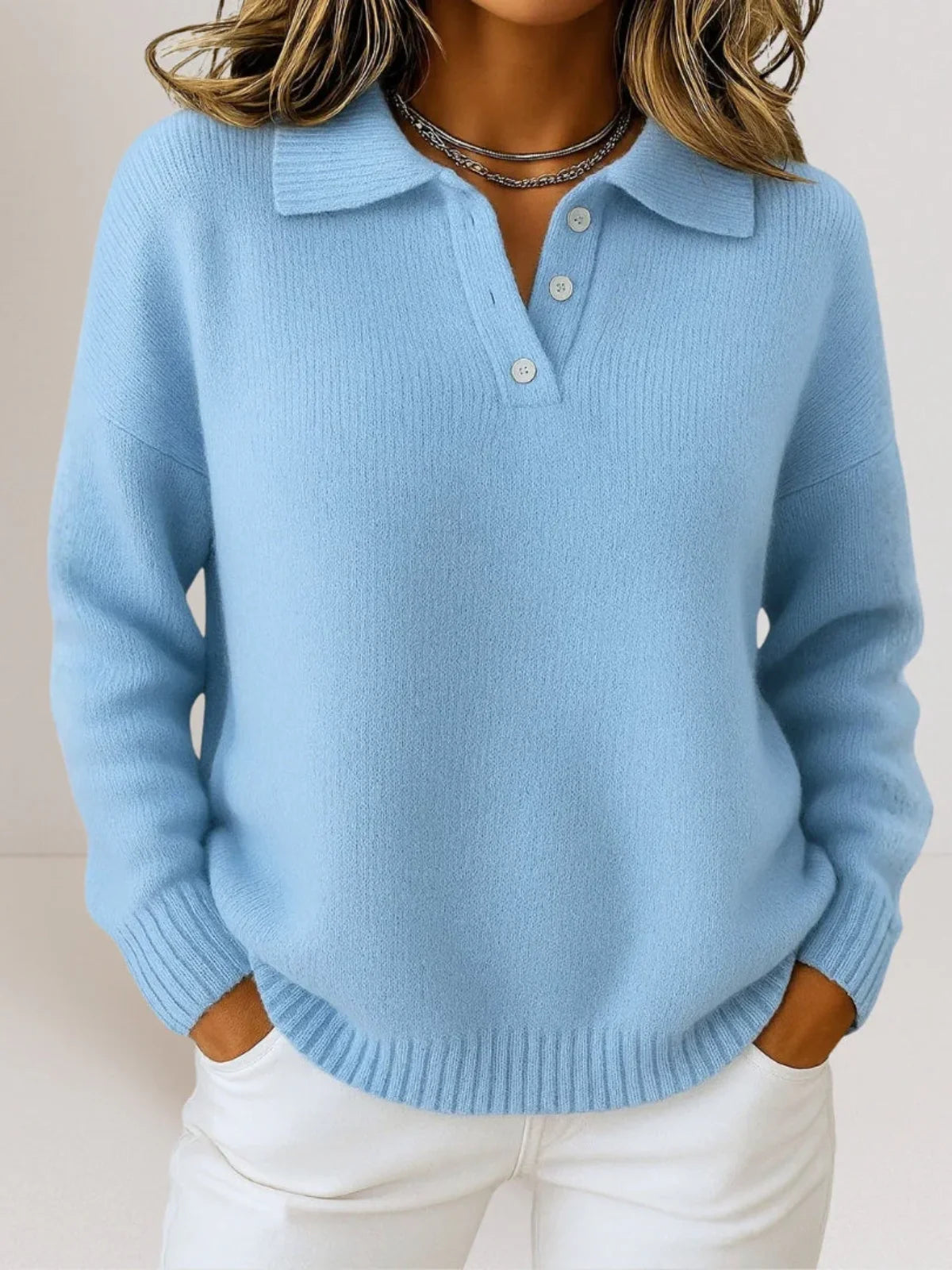Blue relaxed knit polo sweater for women by Ilynora, close-up view highlighting soft texture, collar detail and relaxed fit