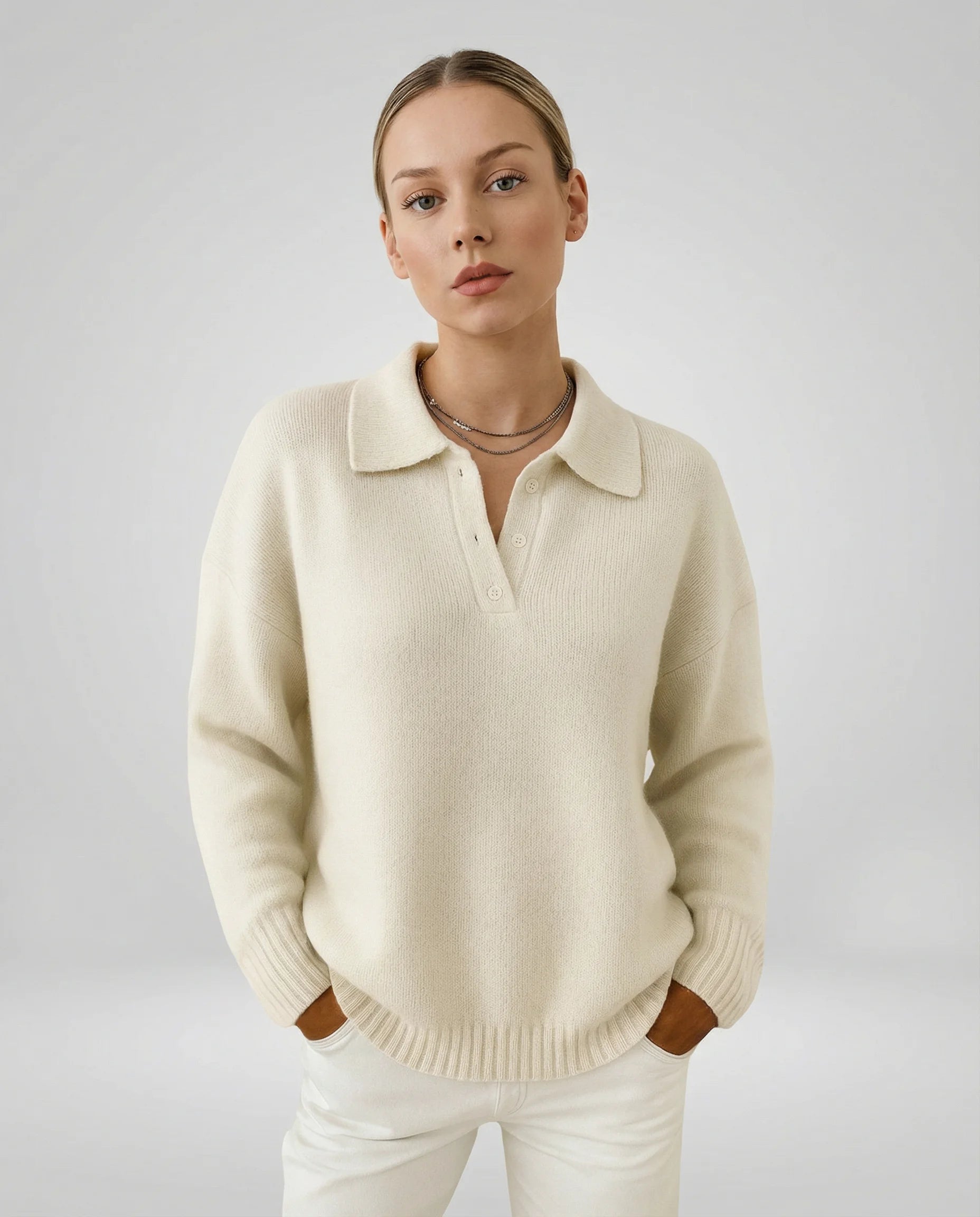 White relaxed knit polo sweater for women by Ilynora, soft minimal design with collar detail and modern casual fit