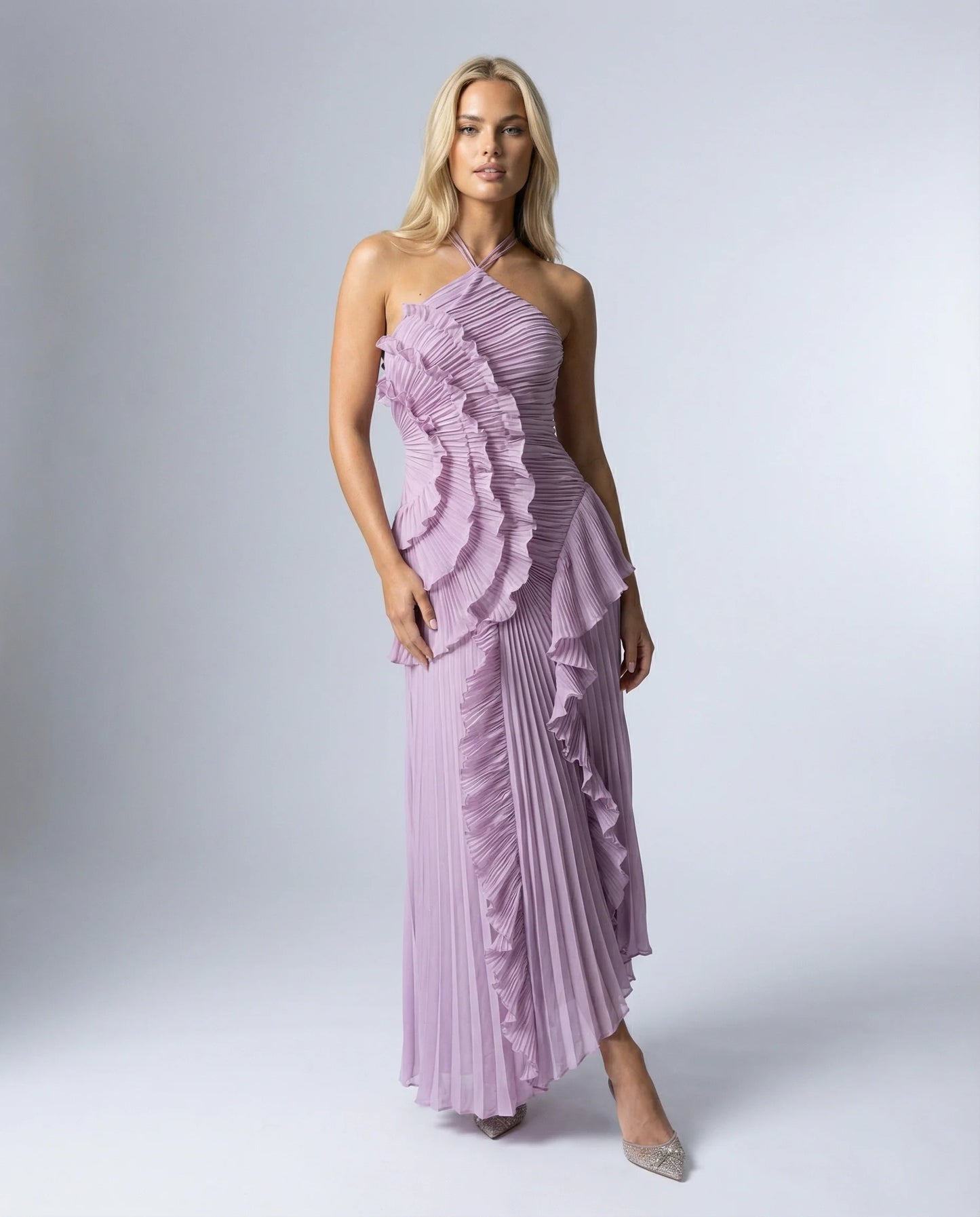 Women's ruffle pleated maxi dress in purple by Ilynora, front view with asymmetric ruffle detail and flowing silhouette