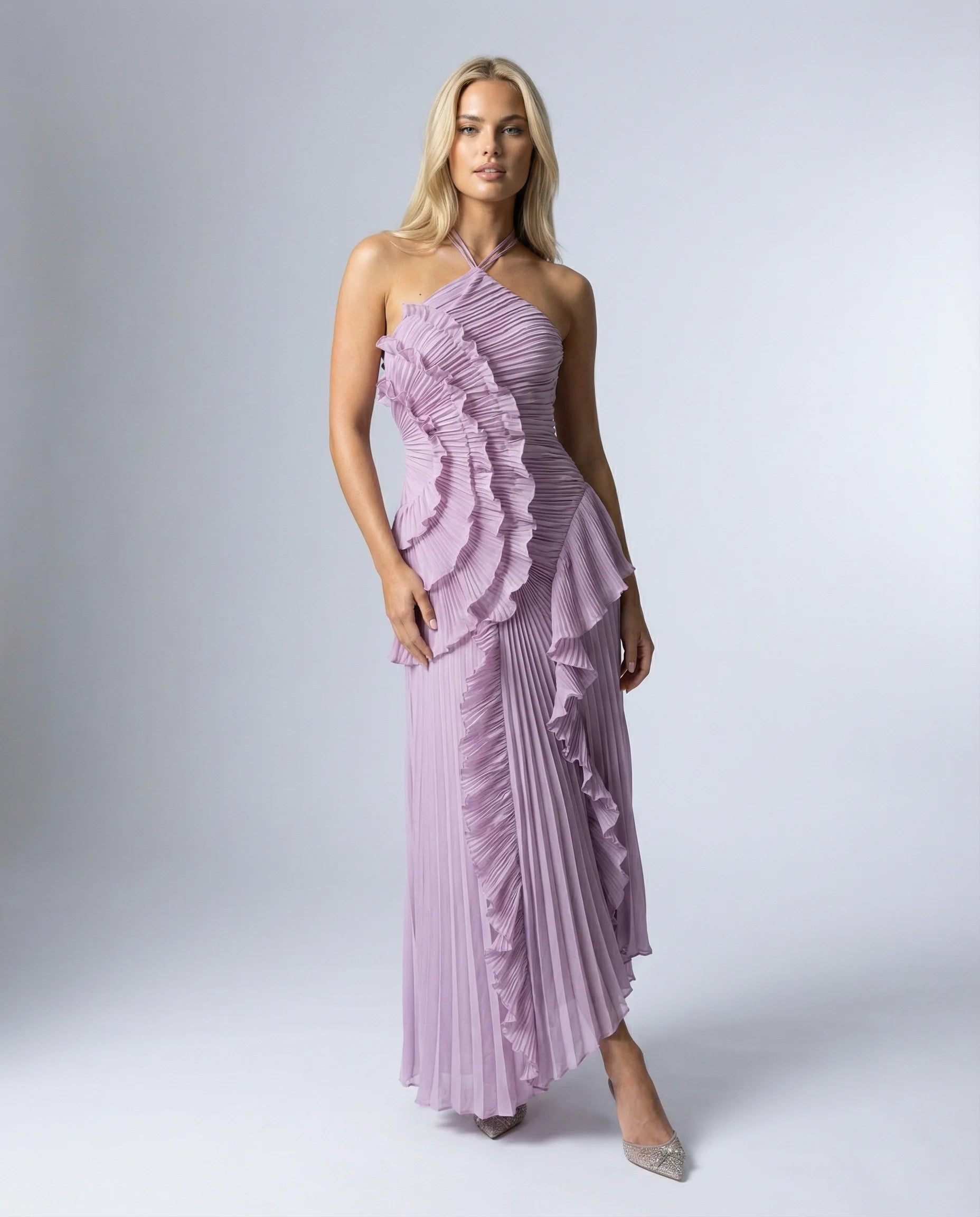 Women's ruffle pleated maxi dress in purple by Ilynora, front view with asymmetric ruffle detail and flowing silhouette