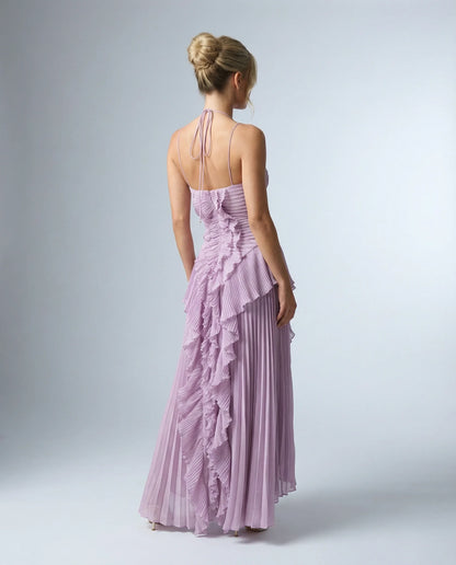 Purple pleated maxi dress with ruffles by Ilynora, back view with cross-back straps and feminine design