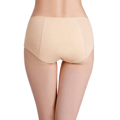 Woman wearing ILYNORA beige high waist period briefs shown from the back