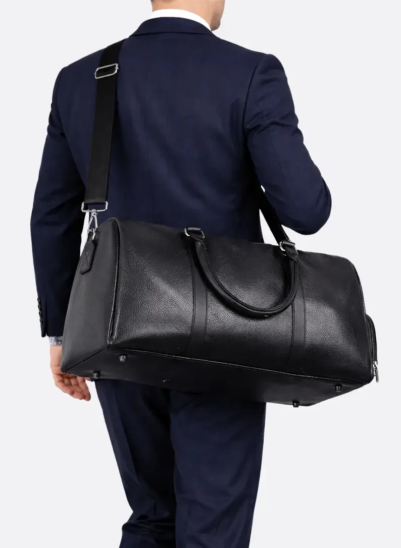 Rear view of black all-in-one gym and travel duffel bag with carry handles, shoulder strap and durable construction by ILYNORA