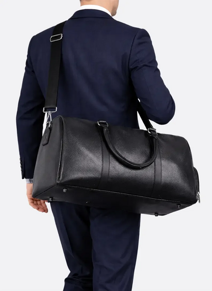Rear view of black all-in-one gym and travel duffel bag with carry handles, shoulder strap and durable construction by ILYNORA