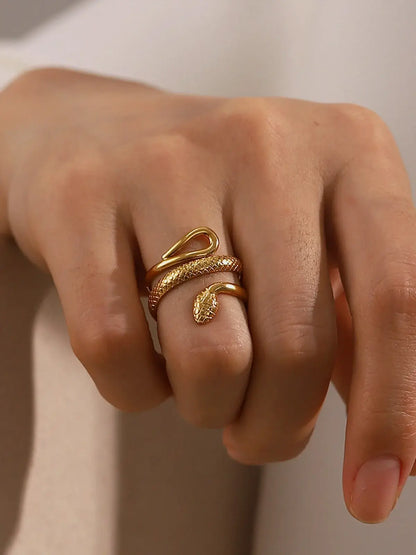 Gold plated look adjustable snake ring by Ilynora, close-up on hand showing modern fit and textured detailing