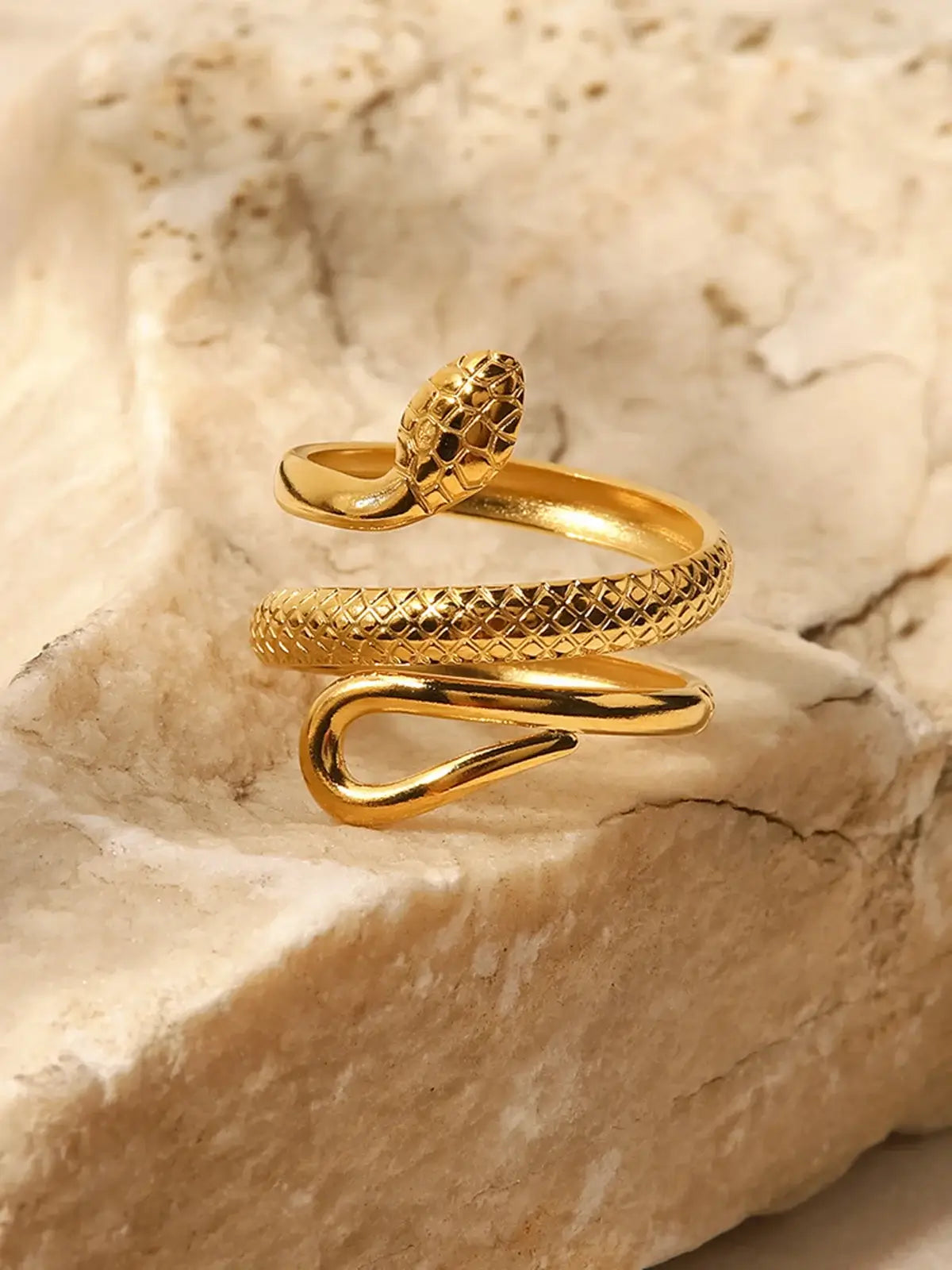 Gold finish snake ring by Ilynora, product close-up showing detailed texture and refined shine