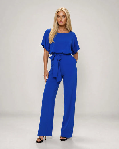 Blue belted wide leg jumpsuit for women by Ilynora, front view with soft drape and modern silhouette