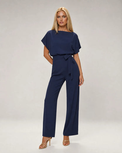 Navy belted wide leg jumpsuit for women by Ilynora, front view with draped sleeves and elegant fit