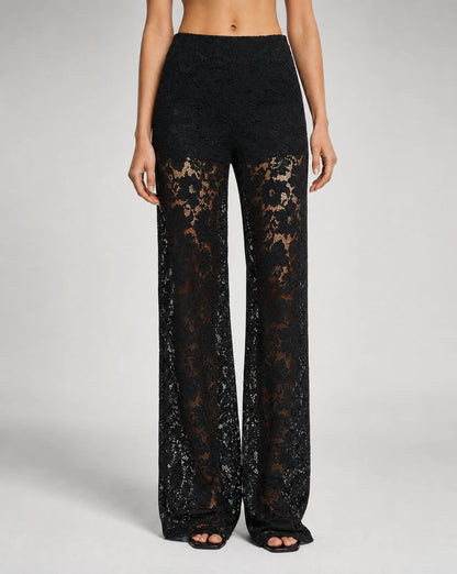 Close-up of women's black floral lace wide leg trousers with elegant sheer lace detailing and tailored finish by ILYNORA