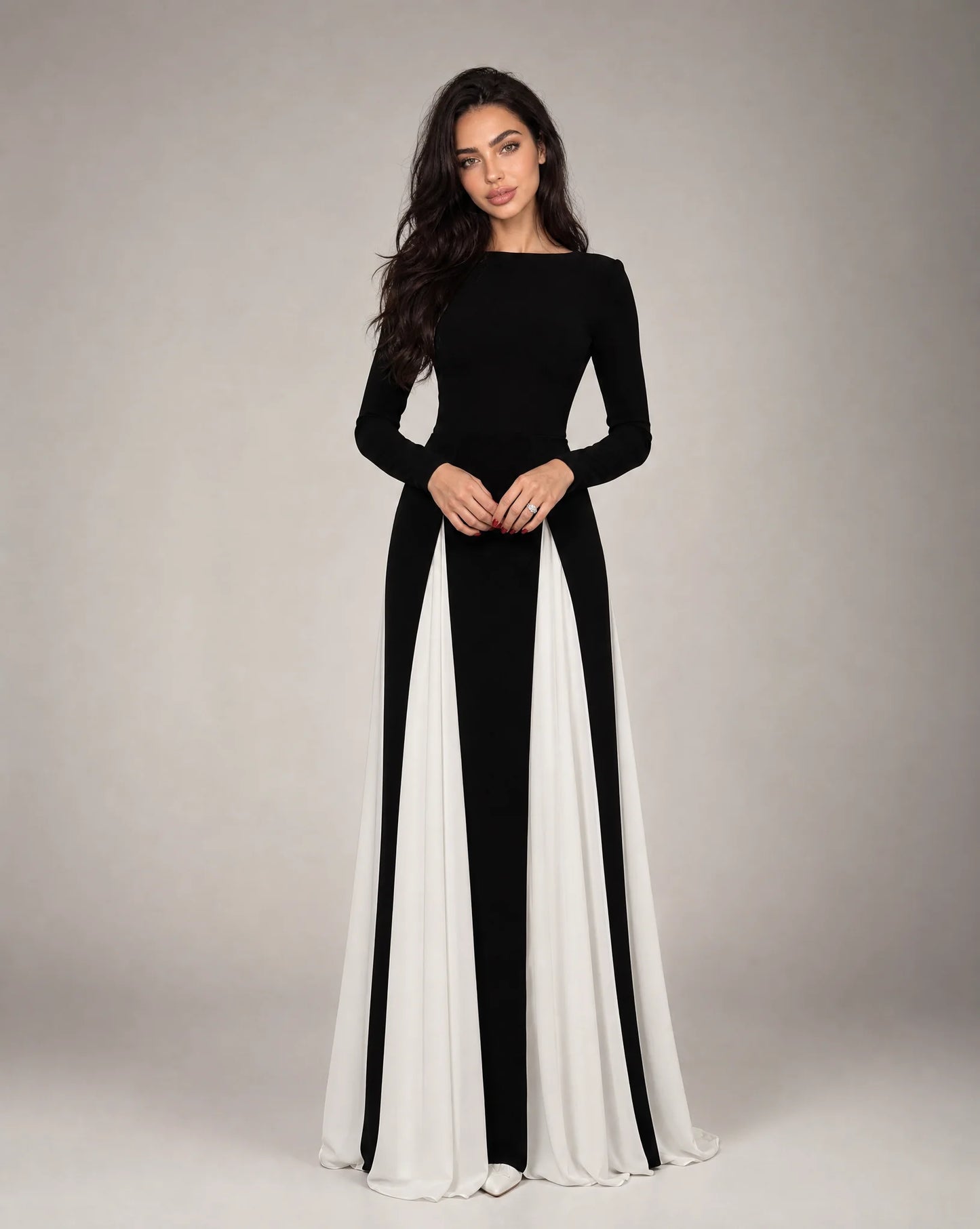 Women's black and white contrast panel evening maxi dress with long sleeves, flowing silhouette and elegant formal design by ILYNORA