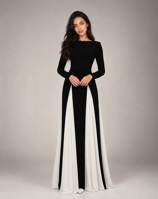 Women's black and white contrast panel evening maxi dress with long sleeves, flowing silhouette and elegant formal design by ILYNORA
