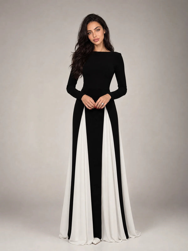 Women's black and white contrast panel evening maxi dress with long sleeves, flowing silhouette and elegant formal design by ILYNORA