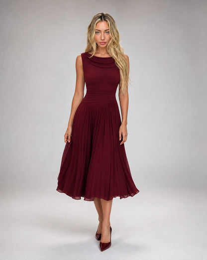 Women's burgundy draped cowl neck pleated midi dress with elegant sleeveless bodice and flowing pleated skirt by ILYNORA