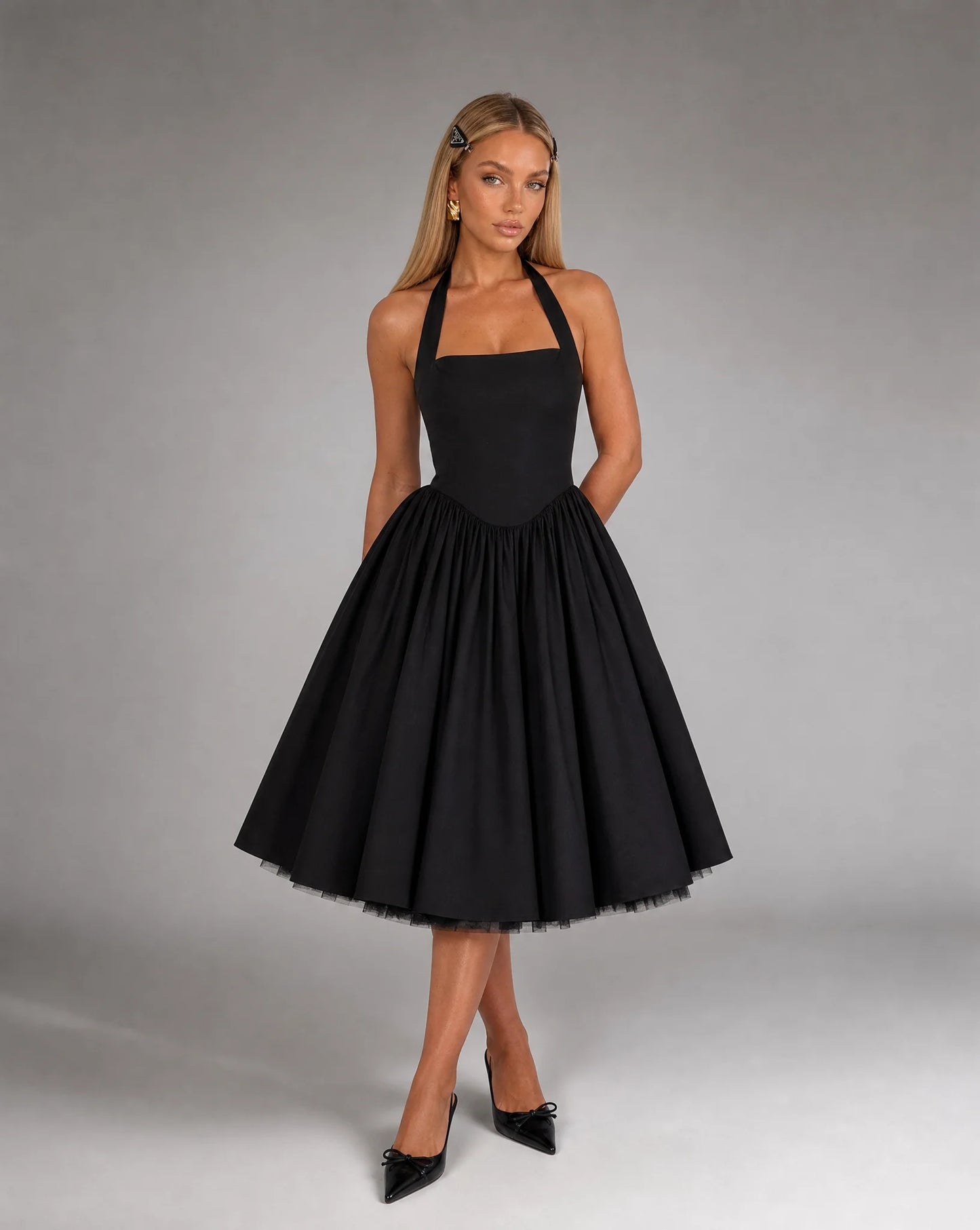 Black corset back midi dress for women by Ilynora, front view with elegant shape and flowing midi skirt