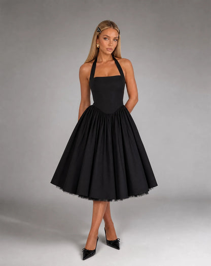 Black corset back midi dress for women by Ilynora, front view with elegant shape and flowing midi skirt