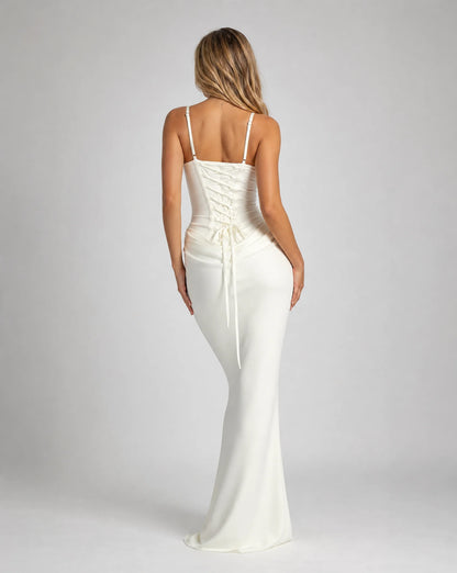 White corset bodycon maxi dress for women by Ilynora, back view highlighting the corset detail and flowing fit