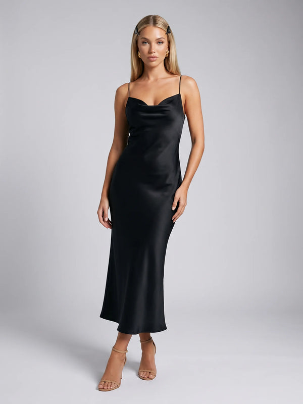 Black cowl neck midi slip dress for women by Ilynora, front view with elegant draped neckline and modern silhouette