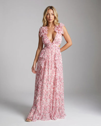 Pink floral ruffle cut out maxi dress for women by Ilynora, full length view with flowing skirt and cut out detail