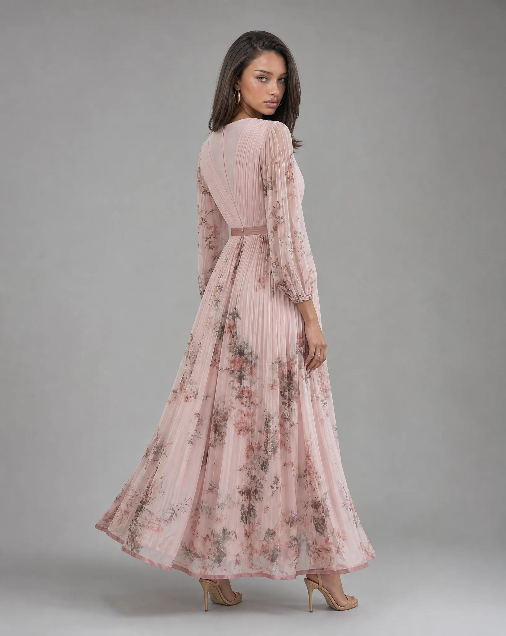 Pink floral V neck maxi dress for women by Ilynora, side view showcasing the flowing skirt and floral design
