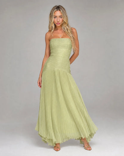 Green strapless pleated maxi dress for women by Ilynora, side view with graceful movement and soft texture