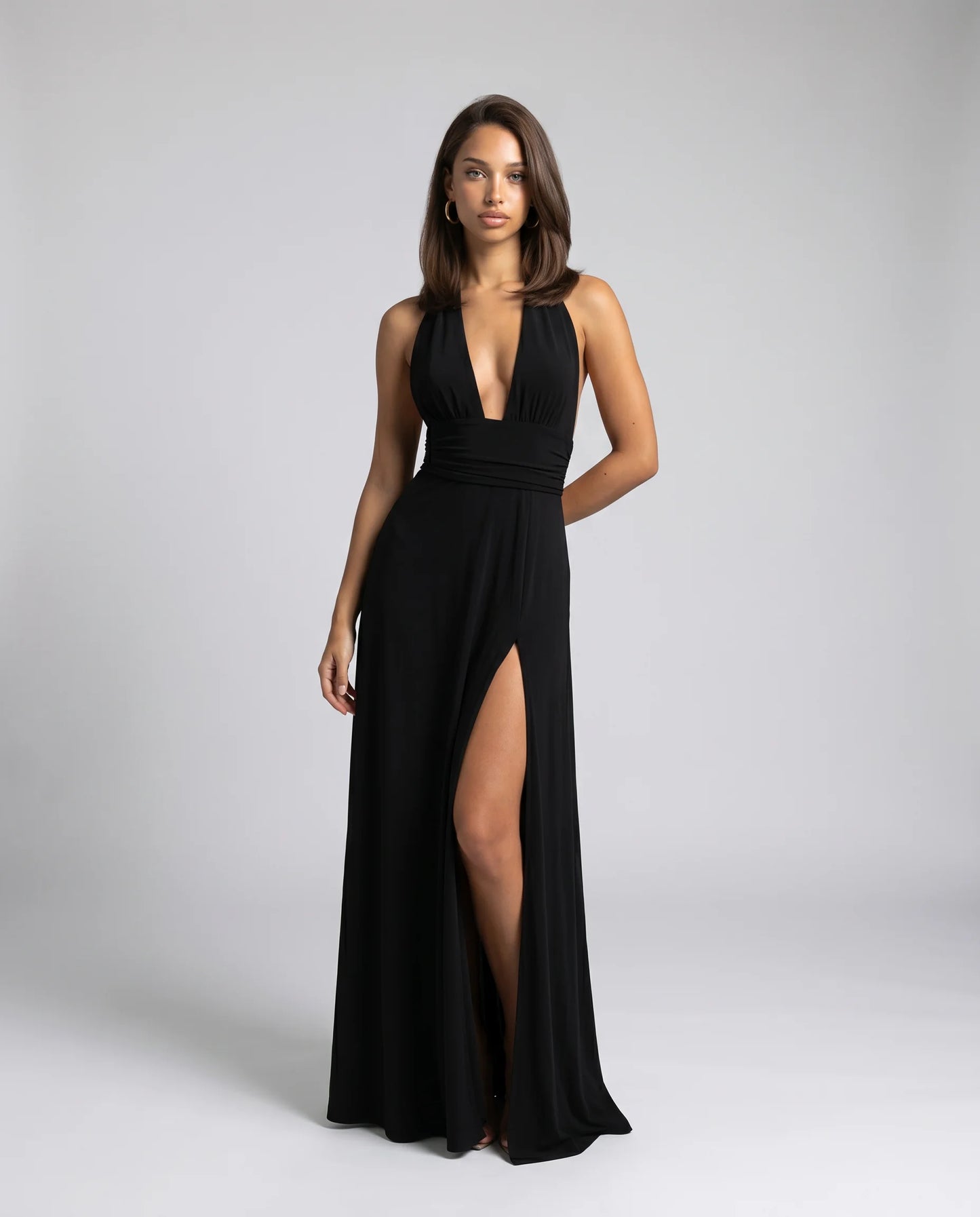 Black halter neck split maxi dress for women by Ilynora, front view with plunging neckline and side slit