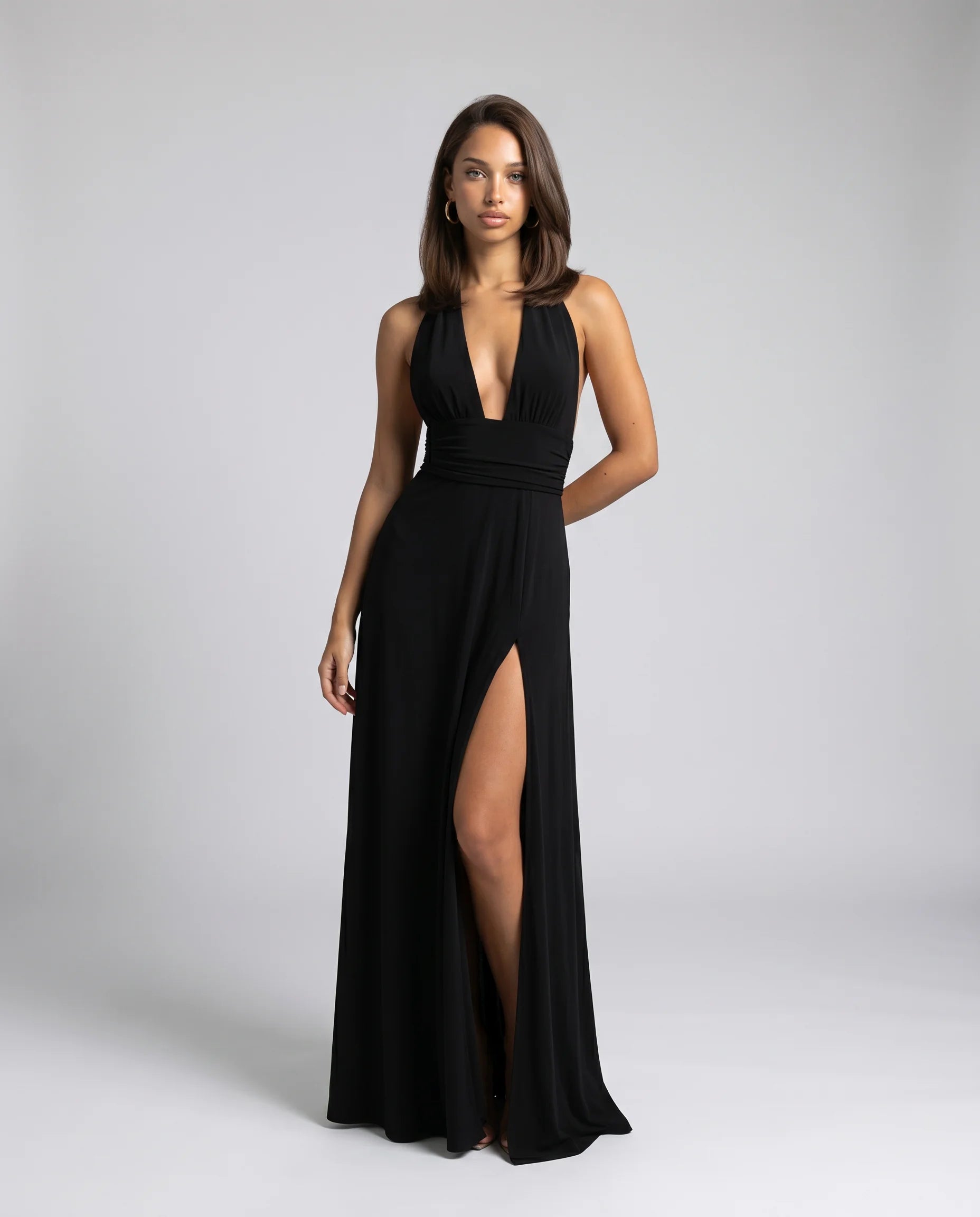 Black halter neck split maxi dress for women by Ilynora, front view with plunging neckline and side slit