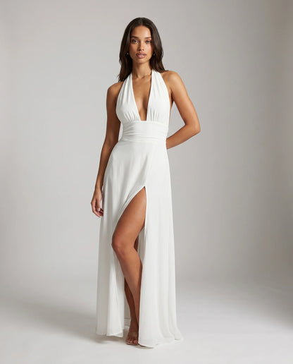 White halter neck split maxi dress for women by Ilynora, front view with plunging neckline and flowing fit