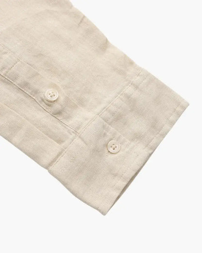 Beige linen shirt by Ilynora, fabric detail highlighting airy weave and soft finish