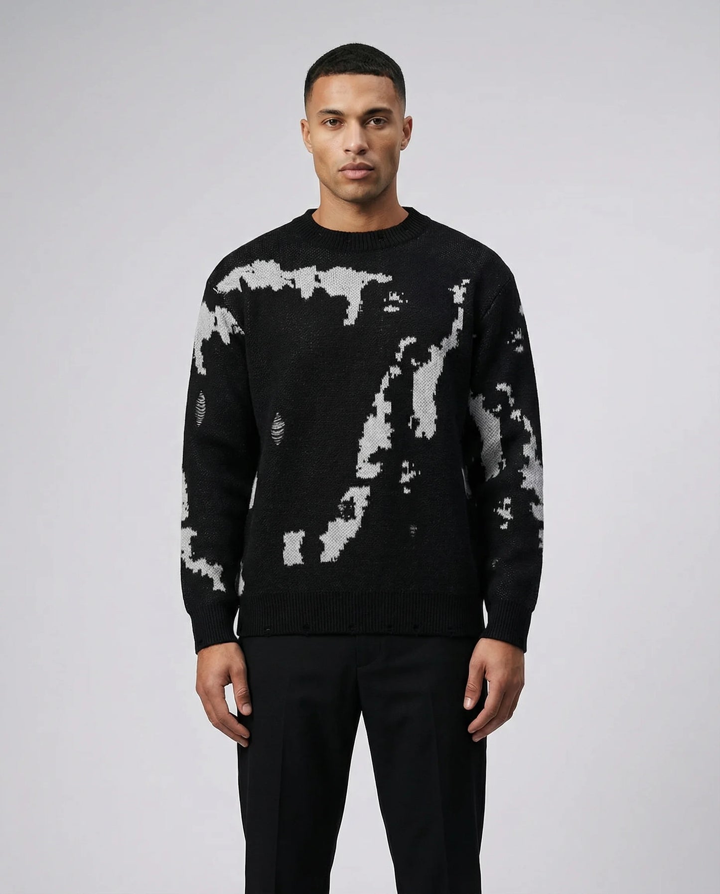 Men's abstract pattern knit crewneck sweater in black by Ilynora, front view with relaxed fit and bold design