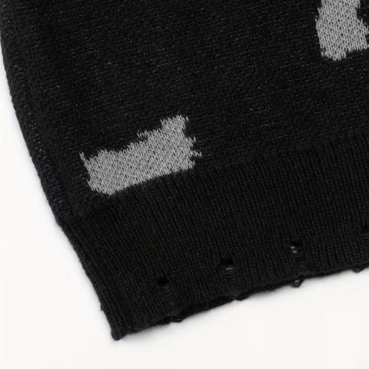 Black crewneck knit sweater by Ilynora, fabric close-up highlighting pattern and soft texture