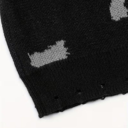 Black crewneck knit sweater by Ilynora, fabric close-up highlighting pattern and soft texture