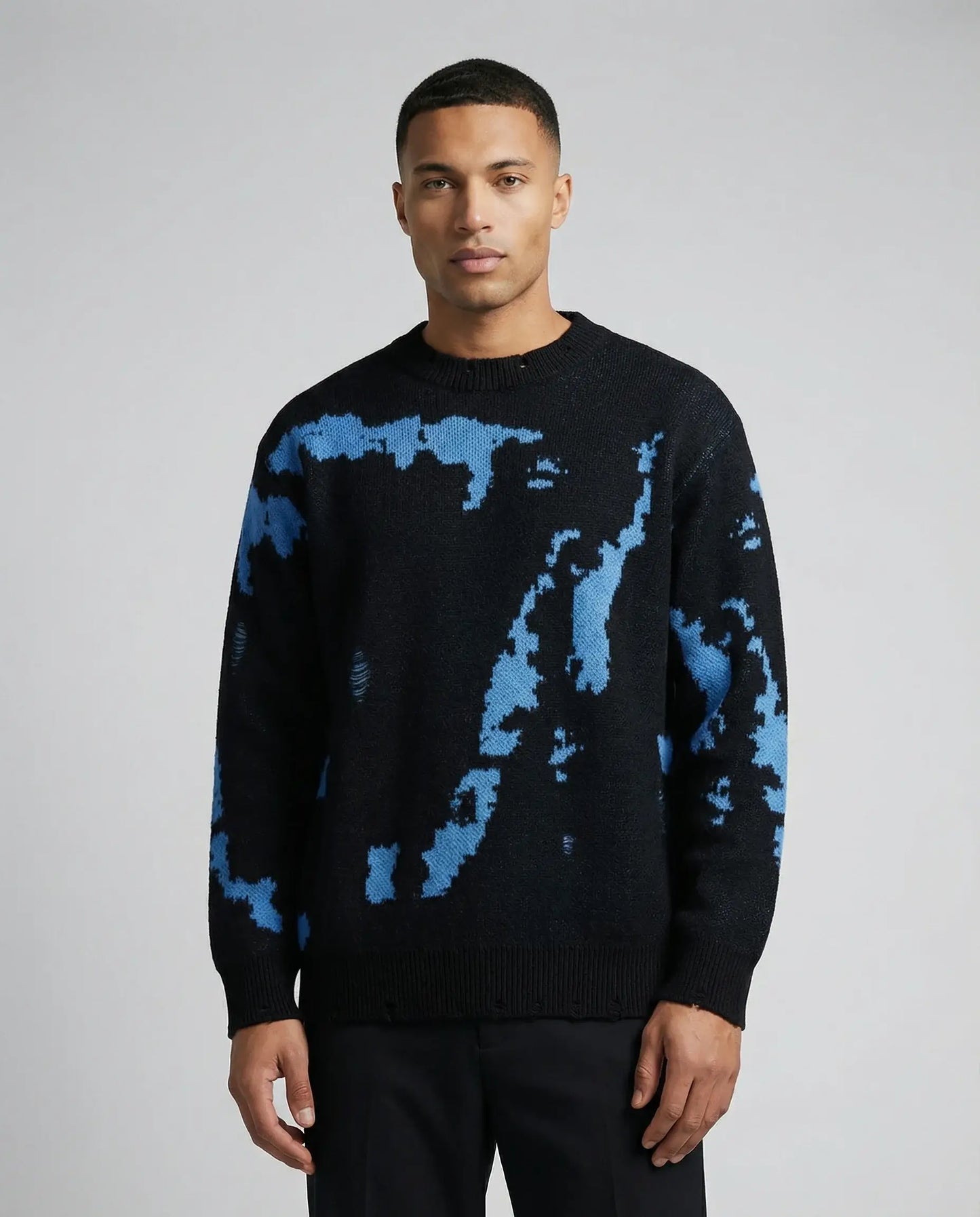 Men's abstract pattern knit sweater in blue by Ilynora, front view with bold design and relaxed fit