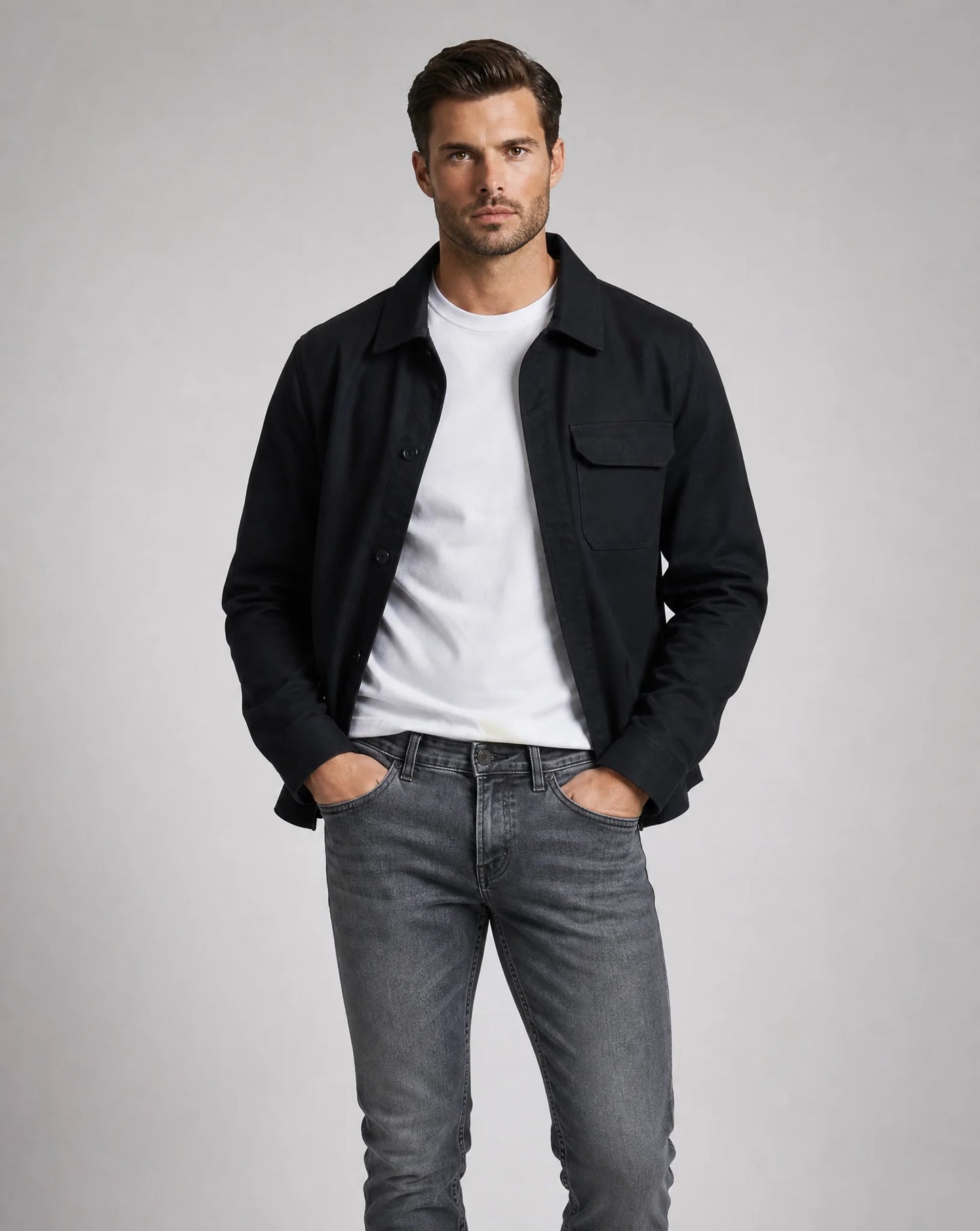 Men's black overshirt jacket featuring chest pockets, button front, lightweight construction and versatile smart-casual styling by ILYNORA