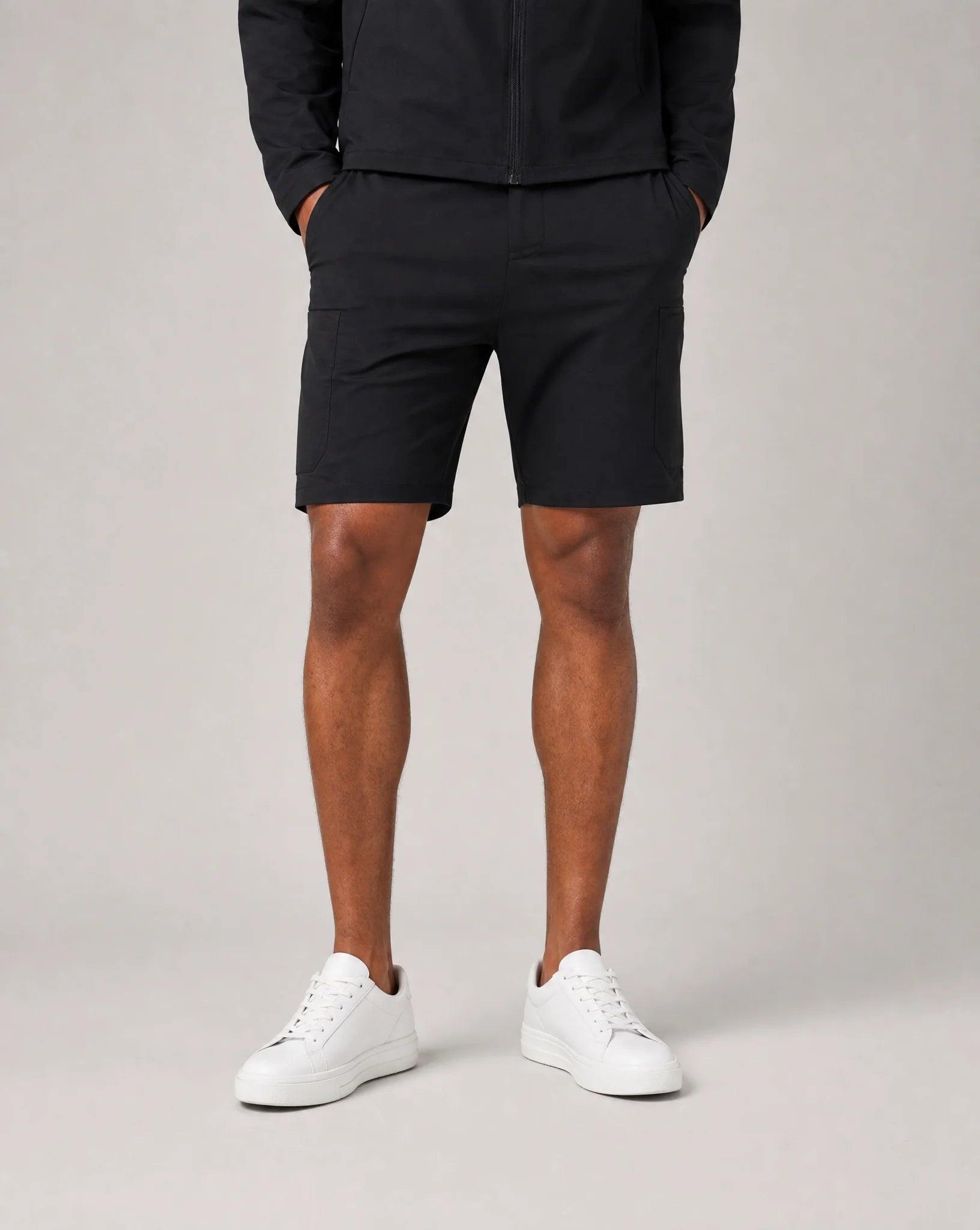 Men's black premium technical shorts with soft shell stretch fabric, drawstring waist and athletic fit by ILYNORA