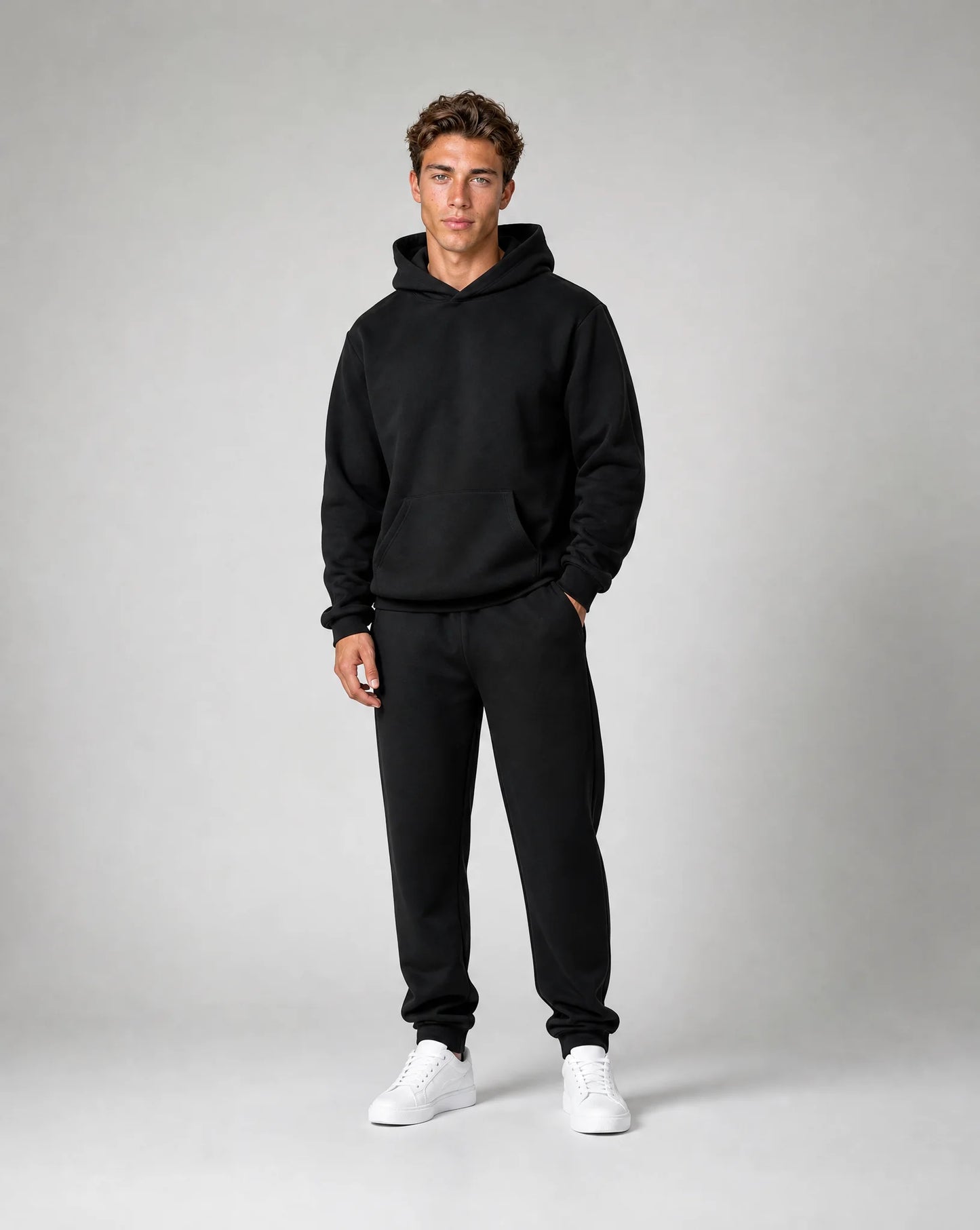 Men's black relaxed fit hoodie and jogger set with heavyweight brushed fleece fabric by ILYNORA