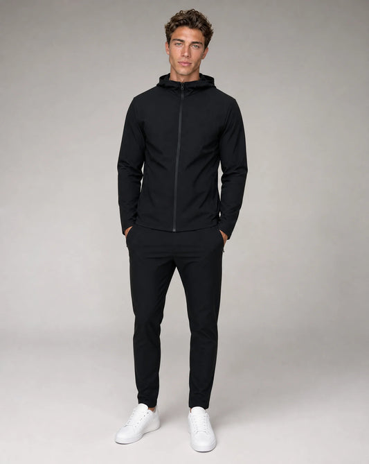Men's black lightweight technical hooded windbreaker jacket with full zip closure and athletic fit by ILYNORA