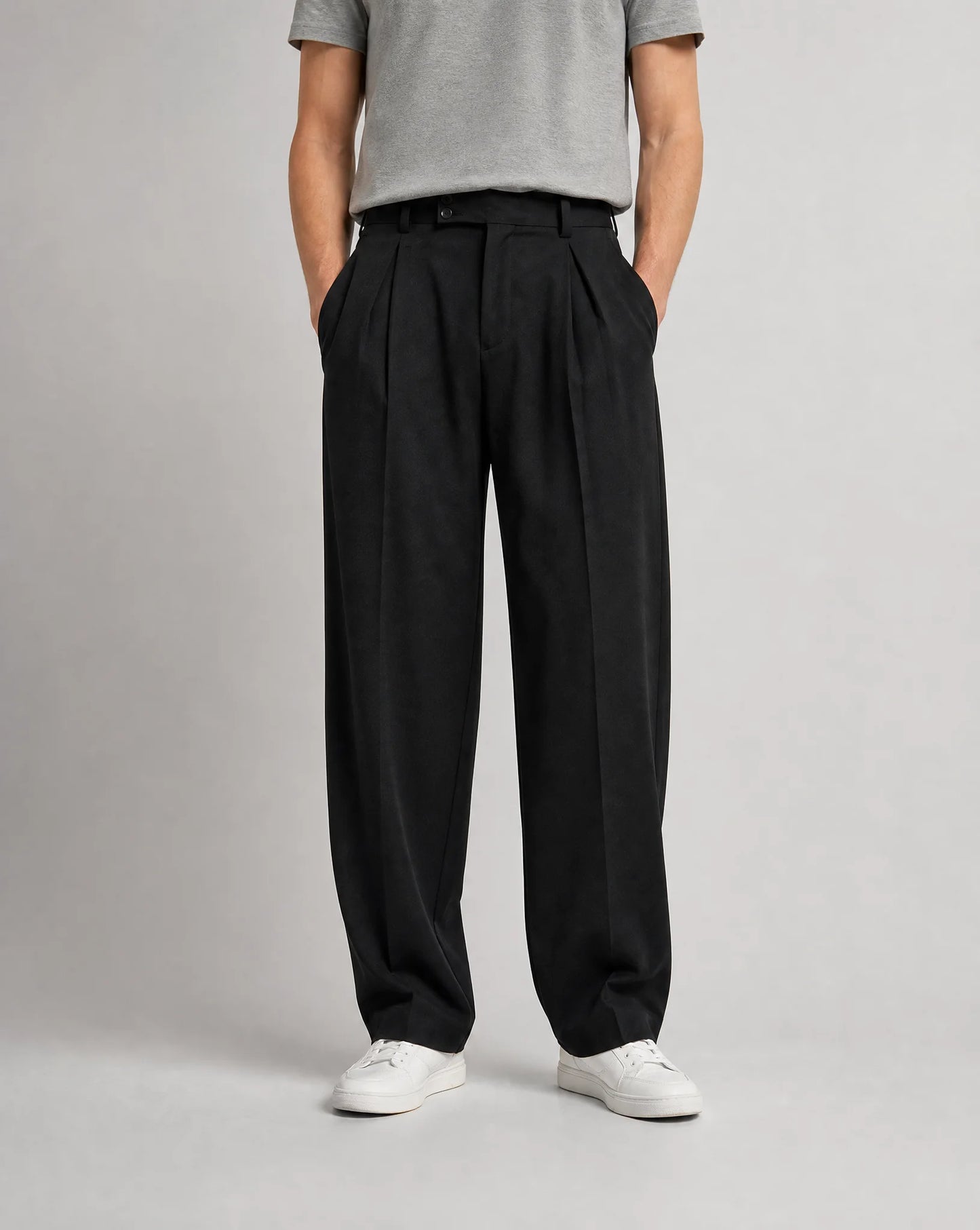 Men's black wide leg pleated tailored trousers with high waist, double front pleats and relaxed smart-casual fit by ILYNORA